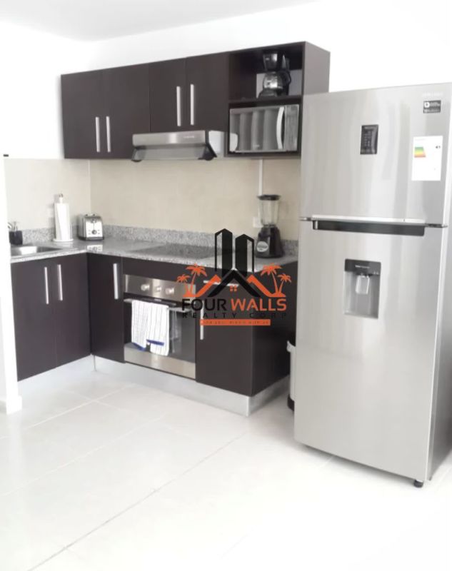 Modern living room with floor-to-ceiling oceanview windows at PH Bay View Panama