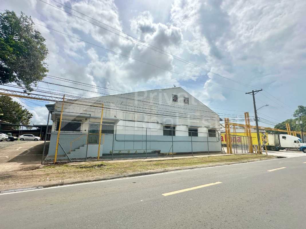 Gated industrial warehouse complex exterior with fenced perimeter Las Acacias Panama