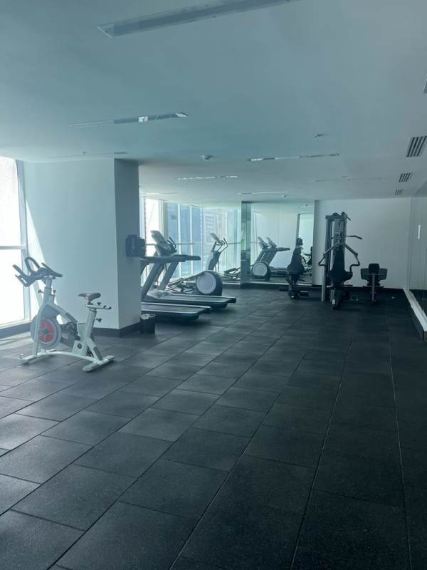 Modern gym with panoramic windows and cardio equipment PH Bella Vista Park Panama