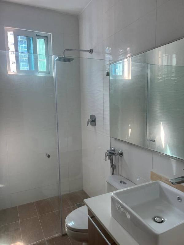Bathroom featuring glass shower enclosure and contemporary vanity in PH Bella Vista Park Panama