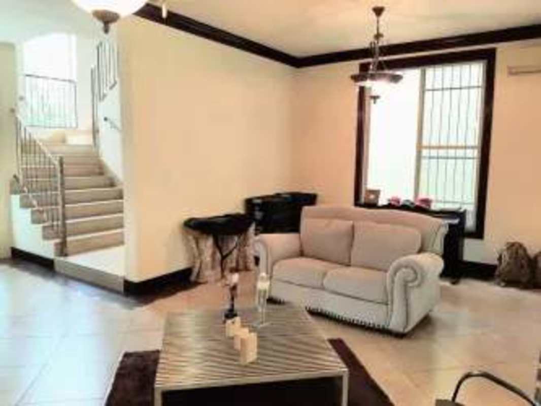Elegant dining area with tile floor large windows split AC Embassy Gardens Panama City