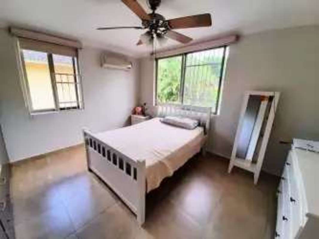 Large master bedroom split AC built-in closets large windows in Embassy Gardens Clayton Panama