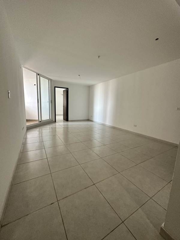 Modern L-shaped kitchen with granite counters in PH Bayview Avenida Balboa apartment for sale