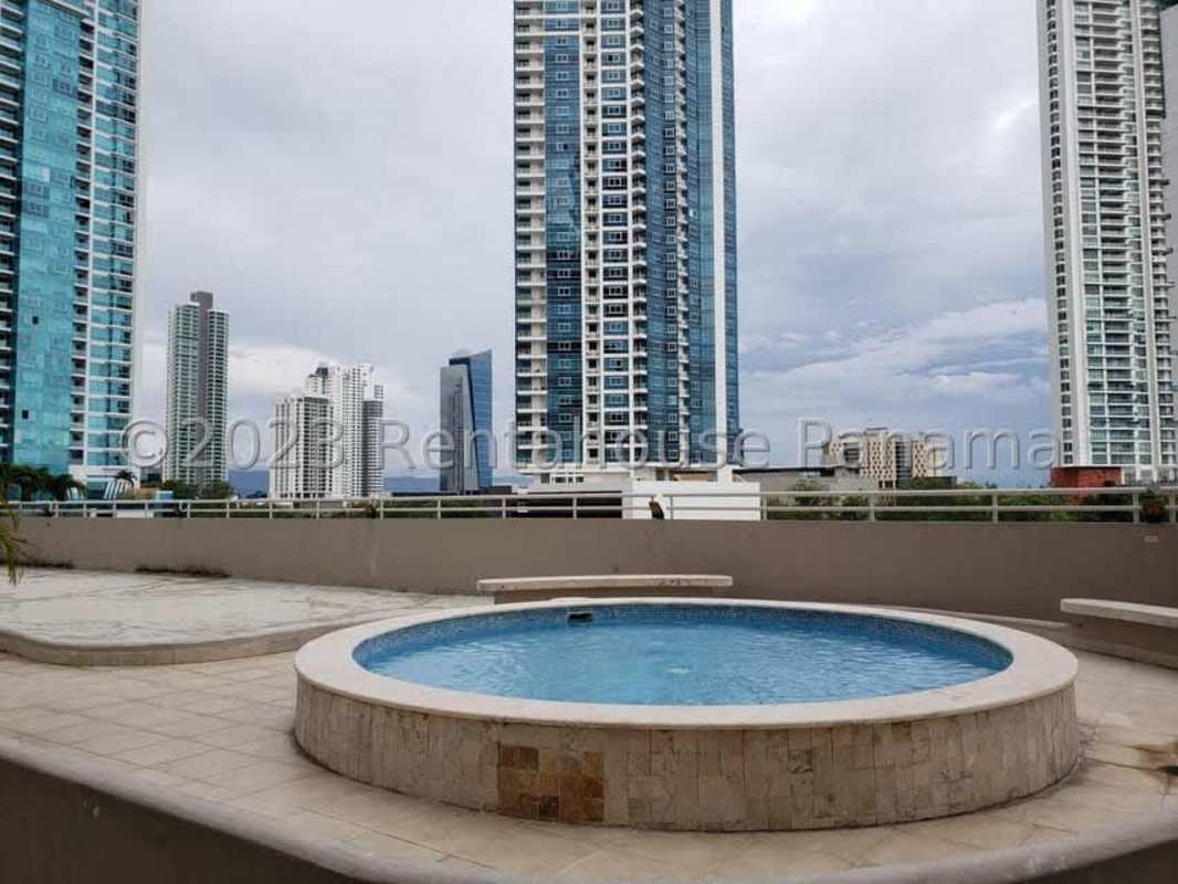 Luxury condo rooftop infinity pool overlooking Panama City skyline and the Pacific Ocean at PH Miramar Costa del Este