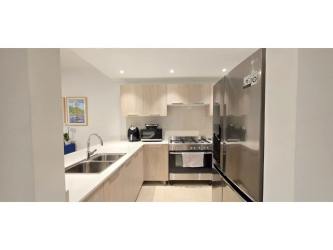 Spacious open-plan living room with garden access in Bosques del Pacífico Panama Pacifico