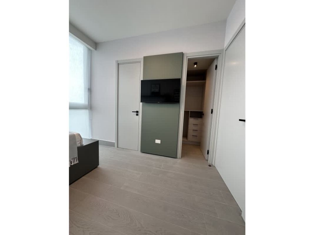 Modern bathroom with marble tiles, double sink vanity, glass shower, The Ivy Santa Maria Panama