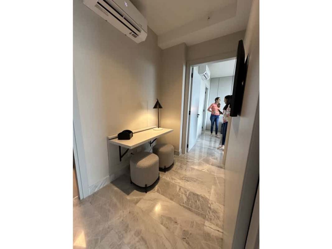 Dining and living area open concept with balcony, marble floors, at The Ivy Santa Maria Panama