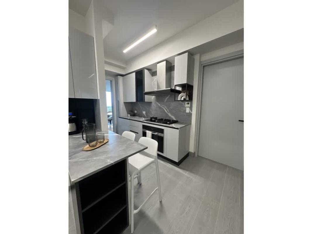 Modern kitchen featuring premium appliances, Italian cabinetry, marble countertops, The Ivy Santa Maria Panama City