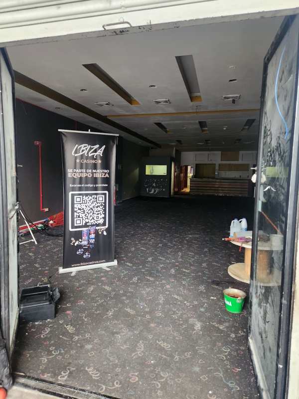 Narrow indoor hallway with decor and doors inside commercial unit Gran Estación Panama