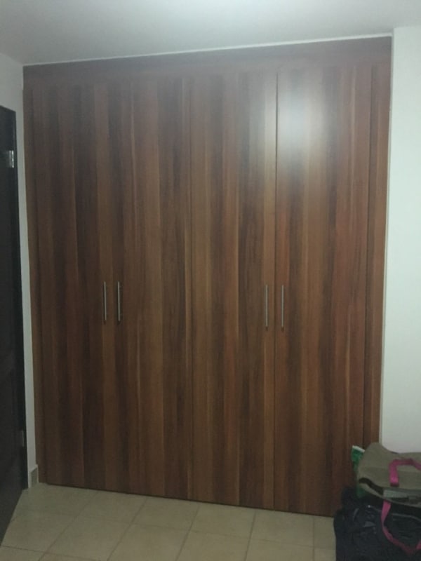 Indoor parking with marked spaces and concrete floors in Parque Lefevre Sky Tower Panama City