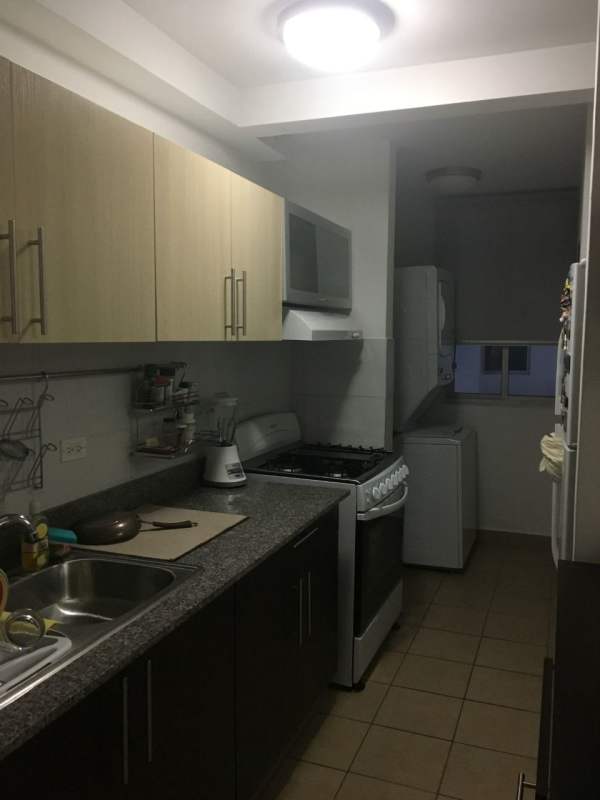 Modern kitchen with appliances, granite surfaces, overhead cabinets Parque Lefevre Sky Panama