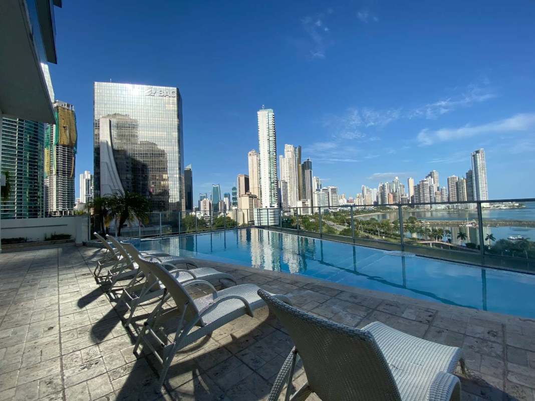 Open kitchen with granite countertops, modern cabinets, island at PH White Tower Avenida Balboa Panama