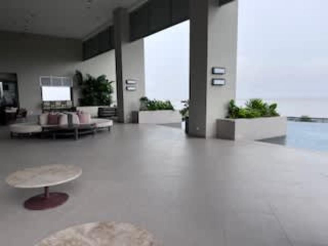 Living room with marble floors panoramic windows ocean view Upper East Costa del Este Panama apartment