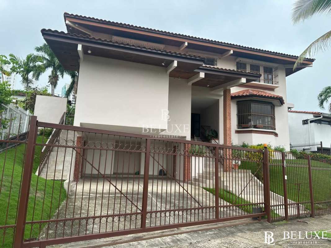 Bright minimalist living room with terrazzo floor multiple windows Altos del Golf luxury house rental Panama