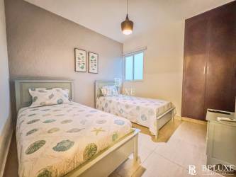 Bathroom with glass shower enclosure and modern fixtures PH Coral Park Playa Blanca condo