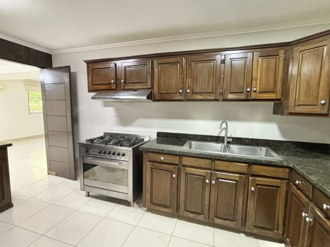 Renovated bathrooms with stylish tile, walk-in showers, vessel sinks in house at Cardenas Clayton Panama