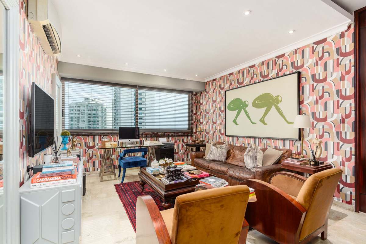 Living room with city skyline windows and eclectic decor in PH Aqualina Punta Pacifica Panama