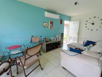 Living room with tiled floor and large window in La Chorrera Panama house for sale
