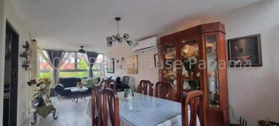 Shared outdoor swimming pool with lounge chairs in Vista Alegre residential Panama Oeste