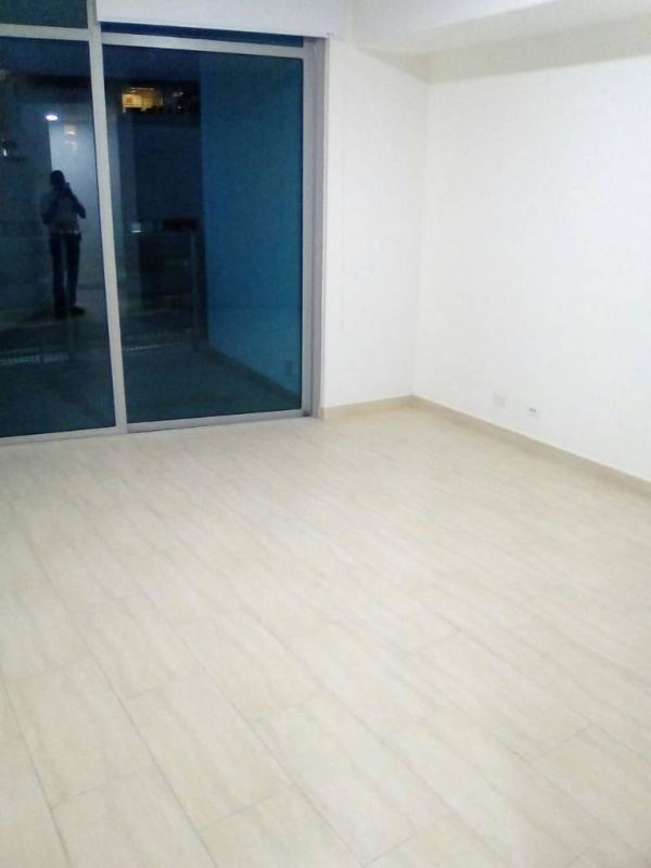 Bright living-dining area with marble tile floors and ocean view balcony in PH Aqualina Punta Pacifica