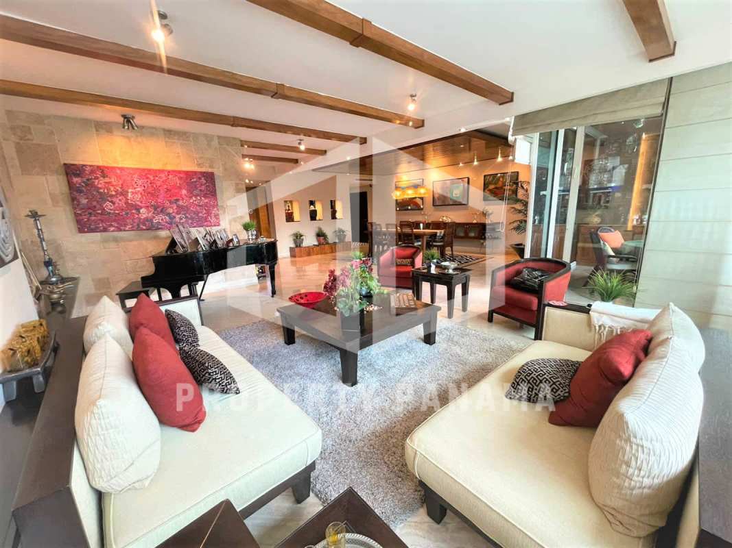 Modern kitchen and breakfast nook with granite counters in PH Peninsula Punta Paitilla Panama apartment