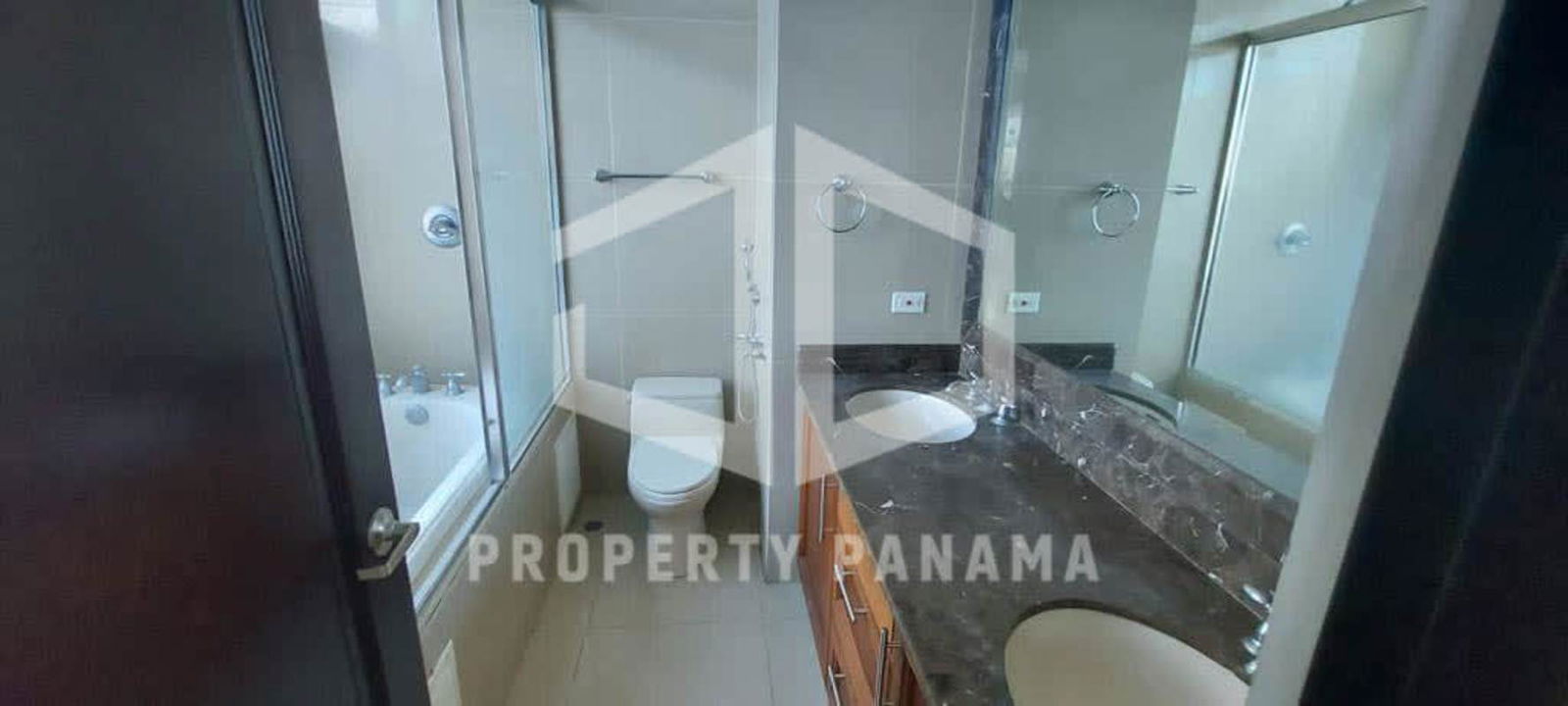 Large kitchen with granite countertops island and wood cabinets PH Ocean Drive Panama