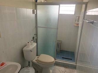 Side exterior view of Vista Alegre house with backyard and fenced boundary Arraiján Panama