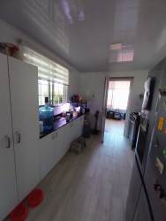 Spacious covered outdoor terrace with tiled floor hammock and decorative walls Urbanización Belmonte