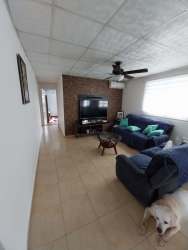 Spacious living dining open layout blue sofas ceiling fans Urbanización Belmonte Panama