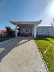 White cabinetry black countertop window appliances in kitchen Belmonte Hato Montaña Panama