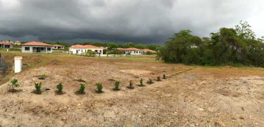 Open grassy lot ready for building surrounded by mountain landscape in Hacienda Pacífica San Carlos Panama