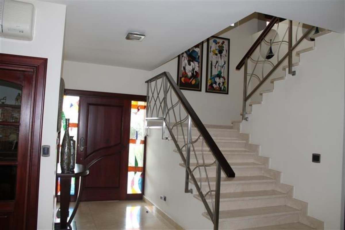 Spacious luxury villa living room with large windows and marble floors in Panama