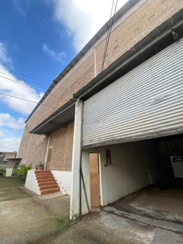 Front exterior of warehouse with security fence and electric gates Juan Díaz Panama