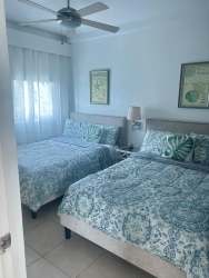 Modern furnished double bedroom with fan in Bijao Rodman Panama apartment
