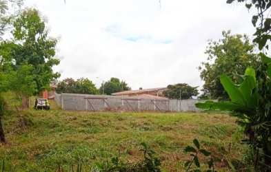 Grassy plot with concrete fence wall and metal gate in El Arenal San Carlos Panama for development