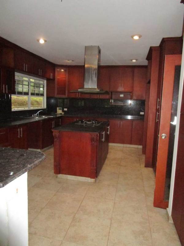 Reception or foyer area with wood panel walls in Lakefront estate Panama