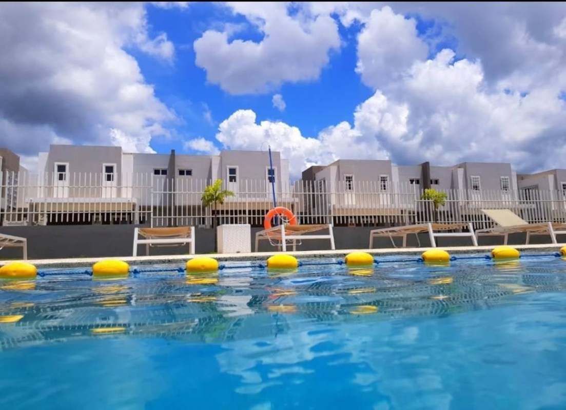 Modern outdoor clubhouse with swimming pool, lounging space at PH Augusta Panama