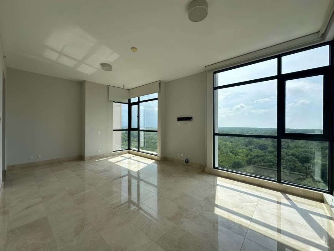 Bright living room with marble floors and panoramic forest and golf views in Santa María Panama