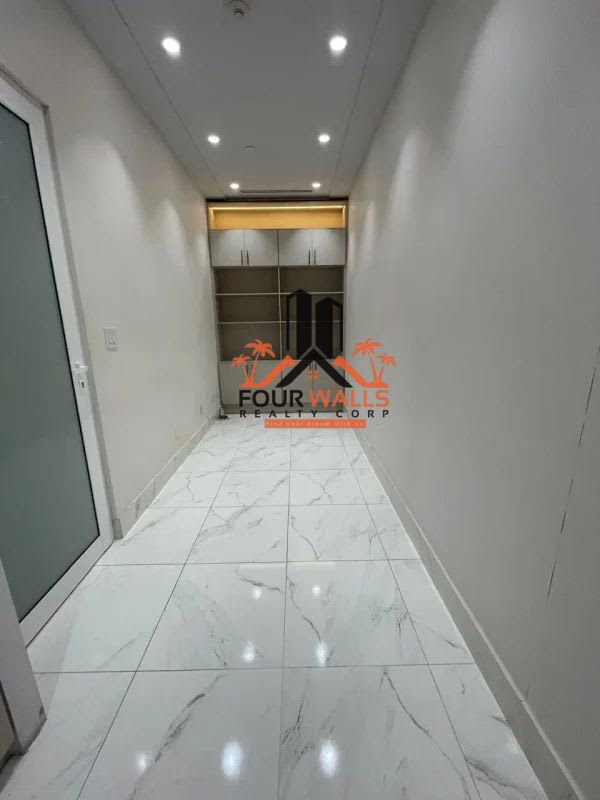 Bright reception space with frosted glass doors, neutral walls and tiled flooring in Town Center Costa del Este Panama