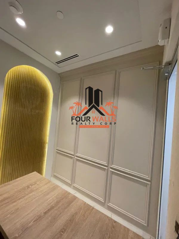 Private office with paneled wall accent lighting wood desk Town Center Costa del Este Panama