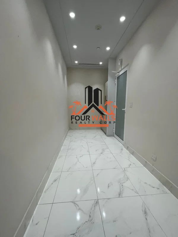 Hallway with marble-like tiles, built-in cabinets, recessed lights Town Center Costa del Este Panama