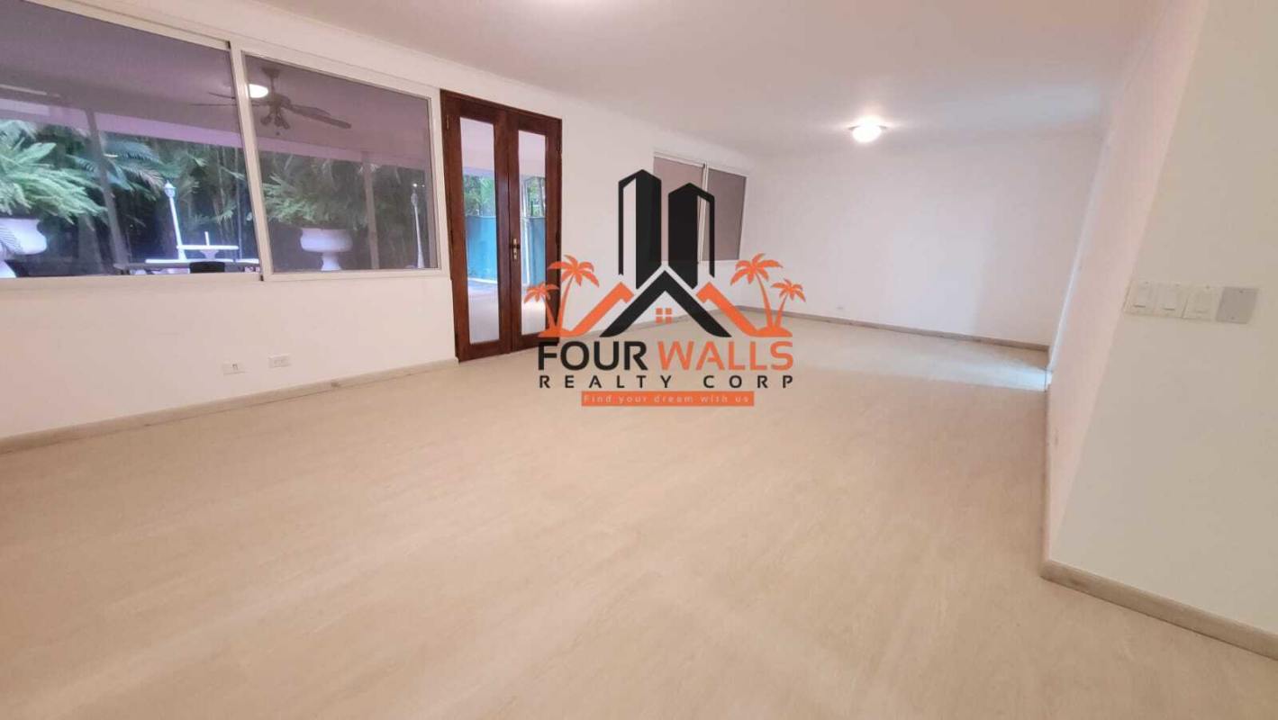 Kitchen with center island, granite countertops and dark cabinetry in Punta Paitilla luxury home