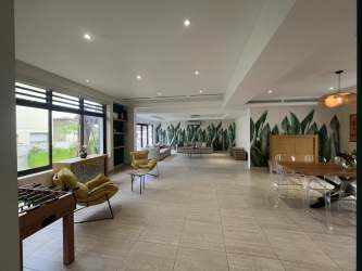 Open plan large living and dining room marble floors PH Nativa Panama Pacifico