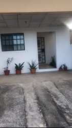 Exterior of single-story house with driveway and porch at Cluster Los Olivos, Costa Verde Panama