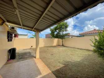 Private backyard with covered patio and green area in Residencial La Arboleda Cluster Los Olivos Panama