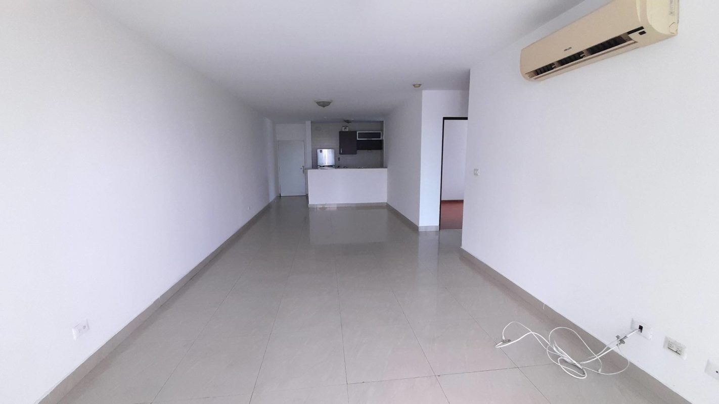 Spacious living room with open kitchen, tile floor, balcony access PH Pacific Sun Punta Paitilla Panama