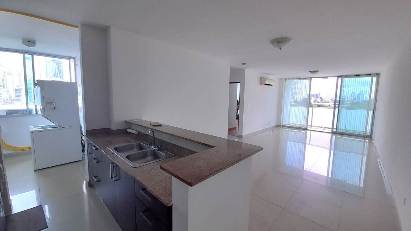 Living dining space with split AC, tile floor, and balcony view PH Pacific Sun Panama