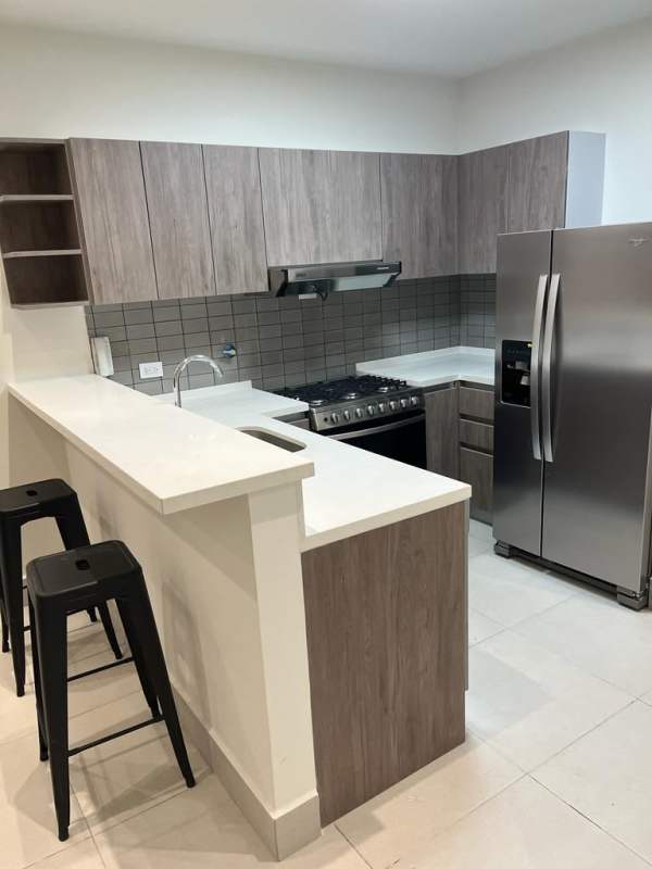 Luxury kitchen with quartz counters and stainless appliances in PH Coco del Mar Tower Panama