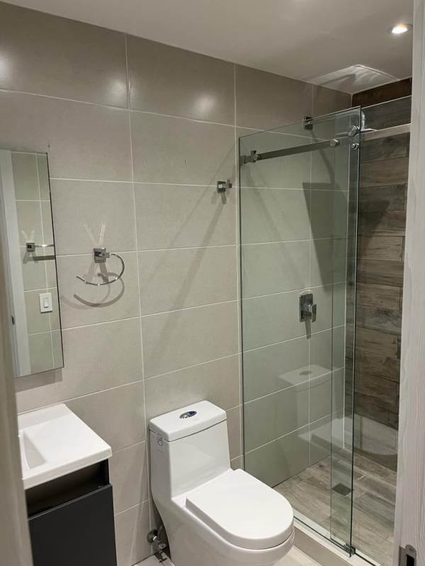 Sleek bathroom with glass shower enclosure and modern fixtures in PH Coco del Mar Tower Panama