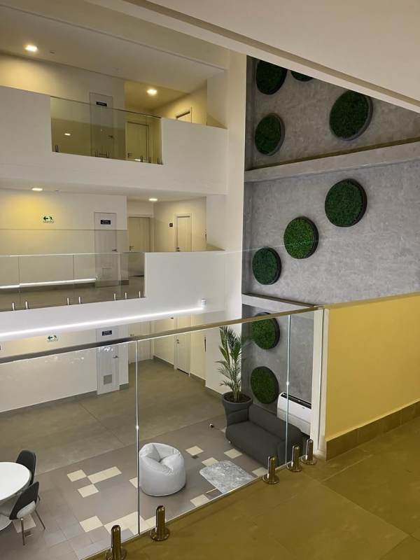 Modern lobby with green wall accents and seating at PH Coco del Mar Tower Panama